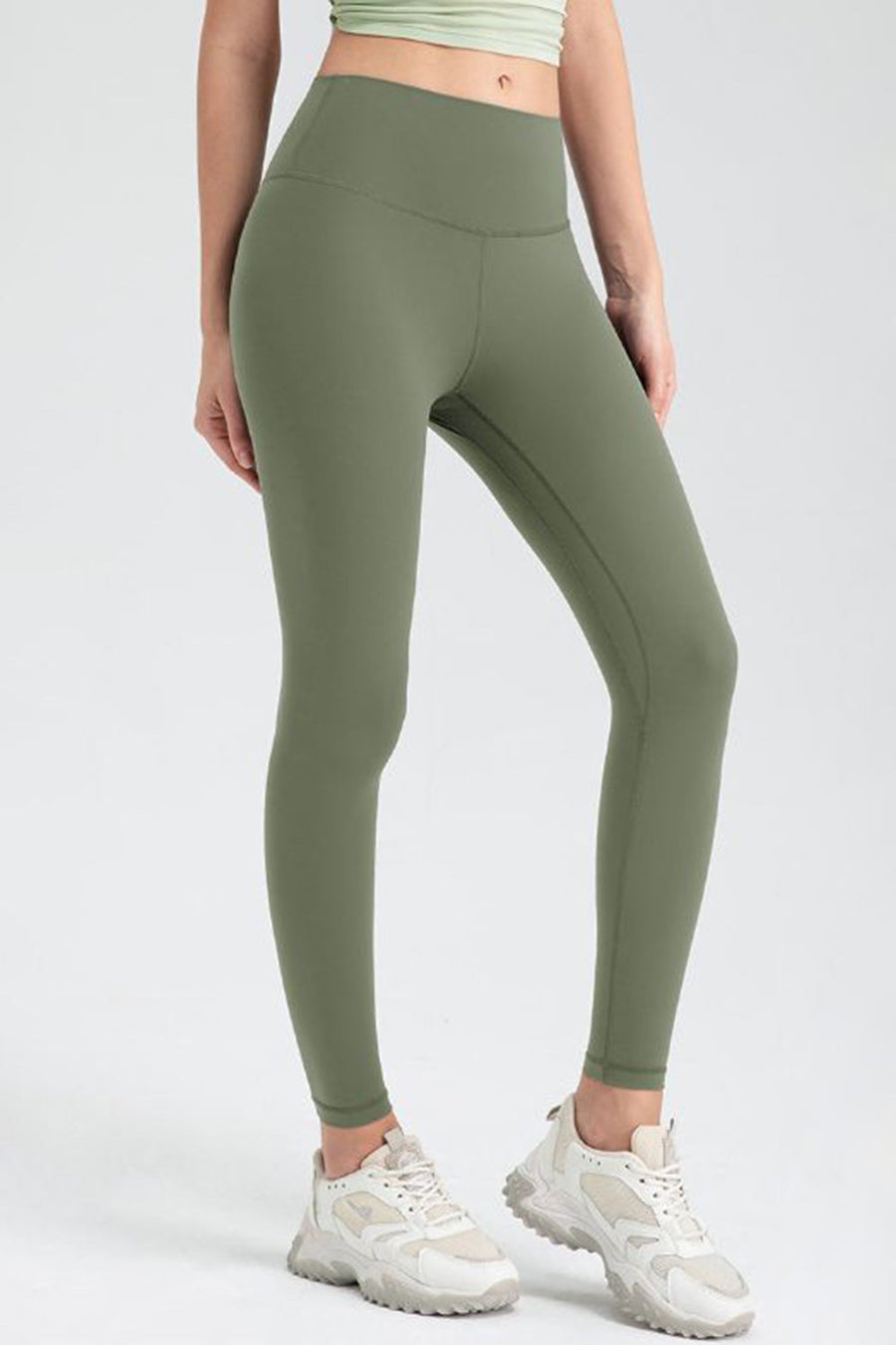 Matcha green high-waist performance leggings with sculpted seams and a smooth finish.