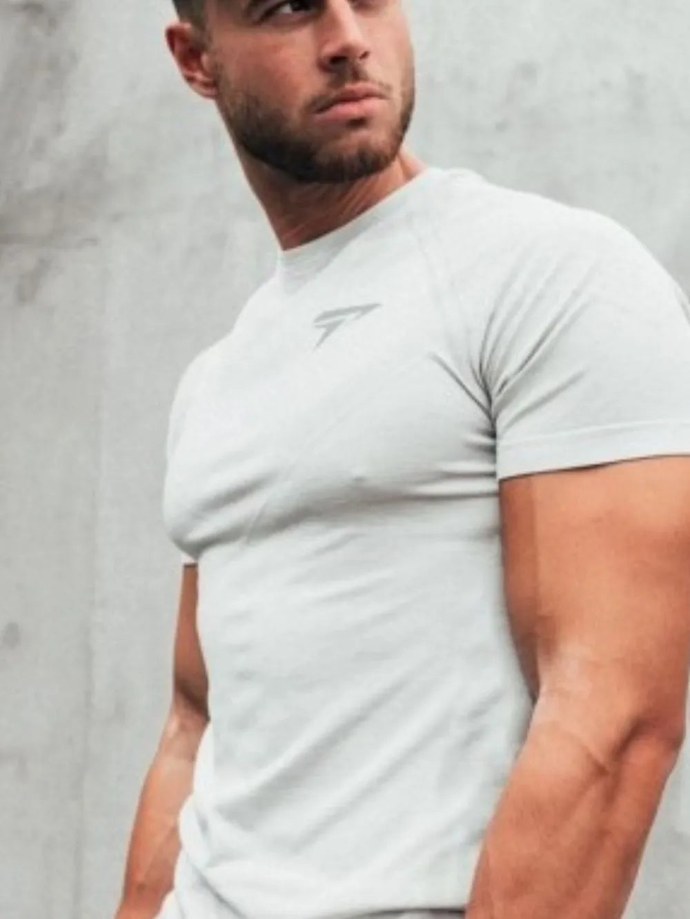 White performance fit raglan sleeve tee with subtle logo detail