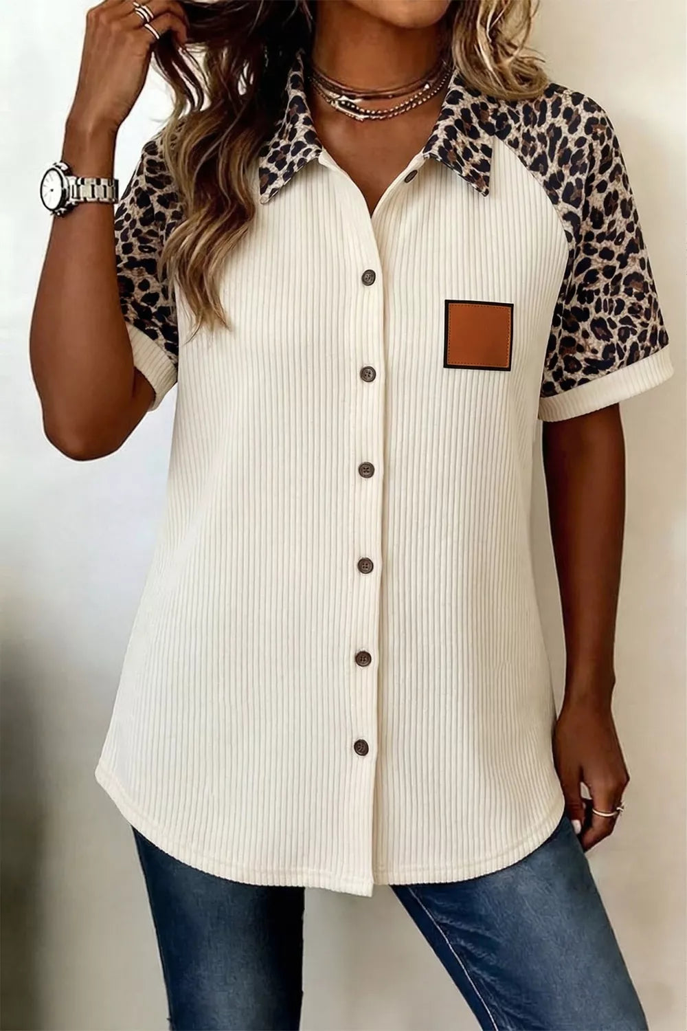 Ribbed cream button-down shirt with leopard print contrast sleeves and collar.