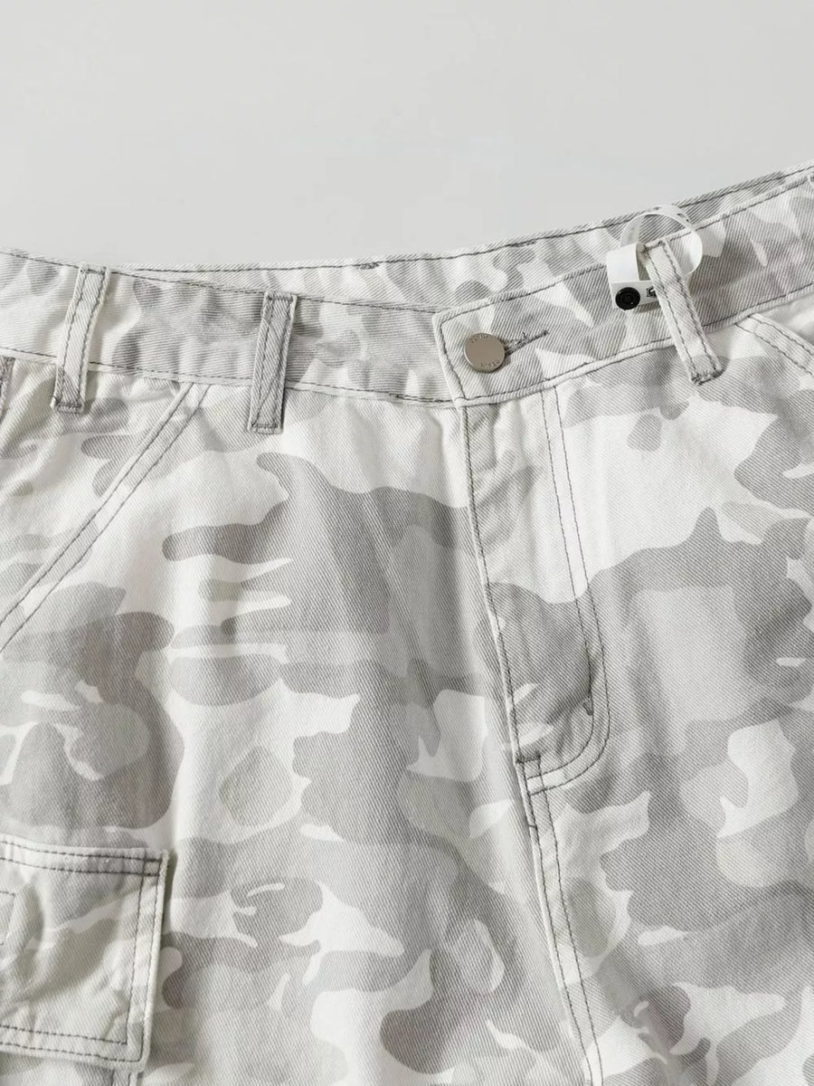 Men's white and grey camouflage cargo pants with utility pockets and button fly.
