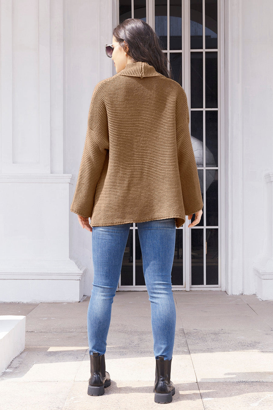 Camel waffle knit cardigan with a shawl collar and relaxed fit.