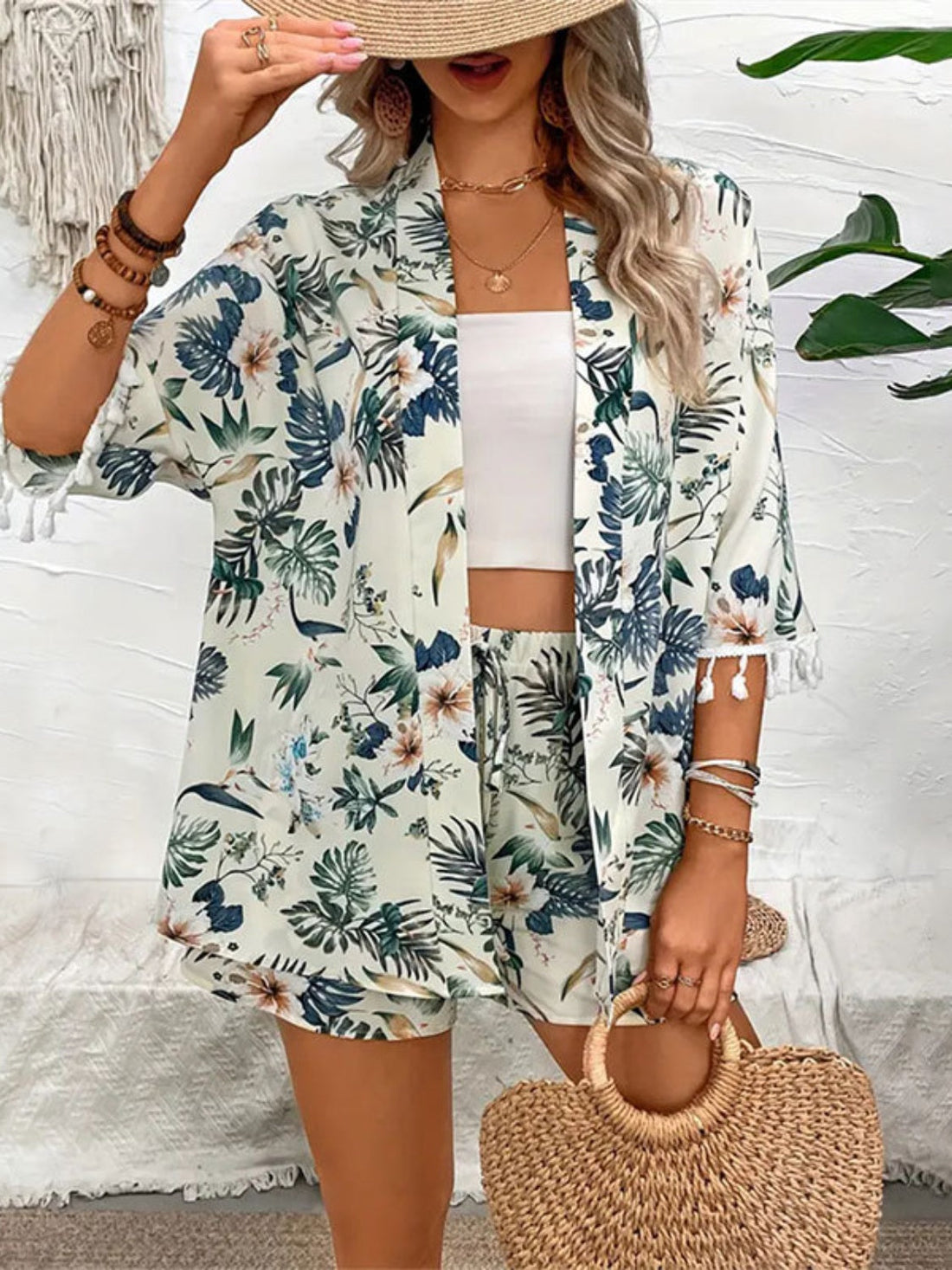 Botanical print kimono and shorts set in light green with tassel trim, styled with a white crop top.