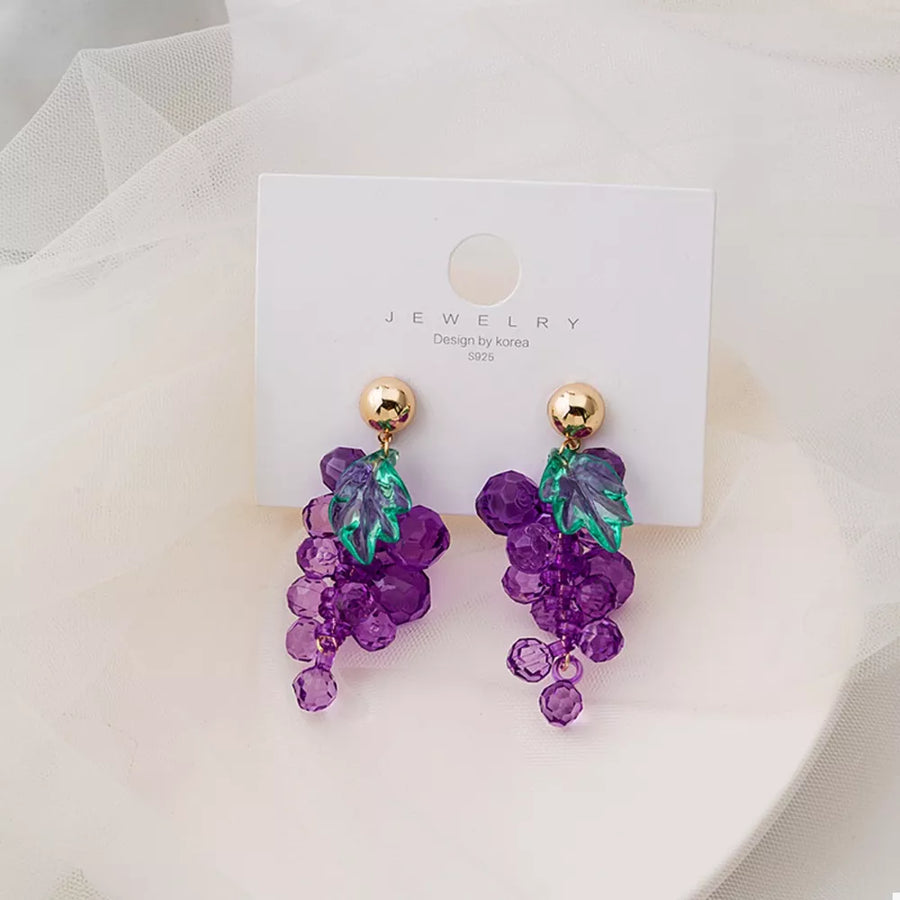 Grape-inspired beaded dangle earrings with gold studs and green acrylic leaves.