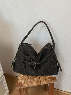 shoulder bag in charcoal featuring buckle details and relaxed fit
