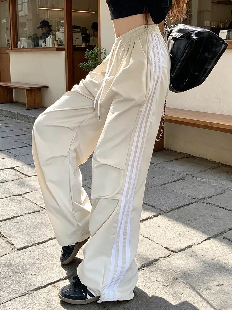 100% polyester Care instructions: Machine wash cold wide-leg pants in cream with loose silhouette