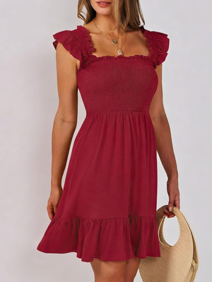 Burgundy smocked mini dress with square neckline and ruffle hem.