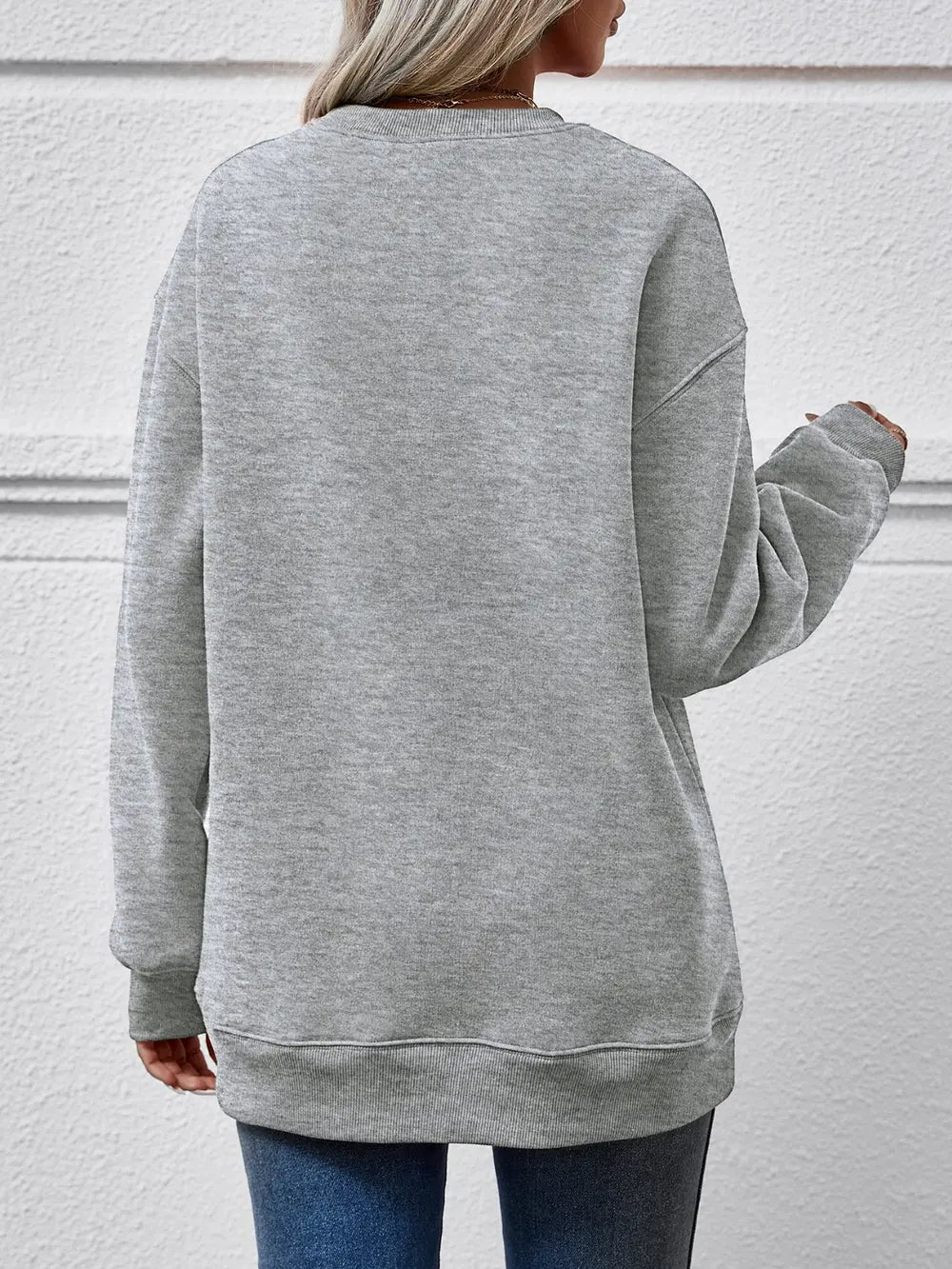 Grey polyester drop shoulder sweatshirt with crewneck and ribbed cuffs and hem.