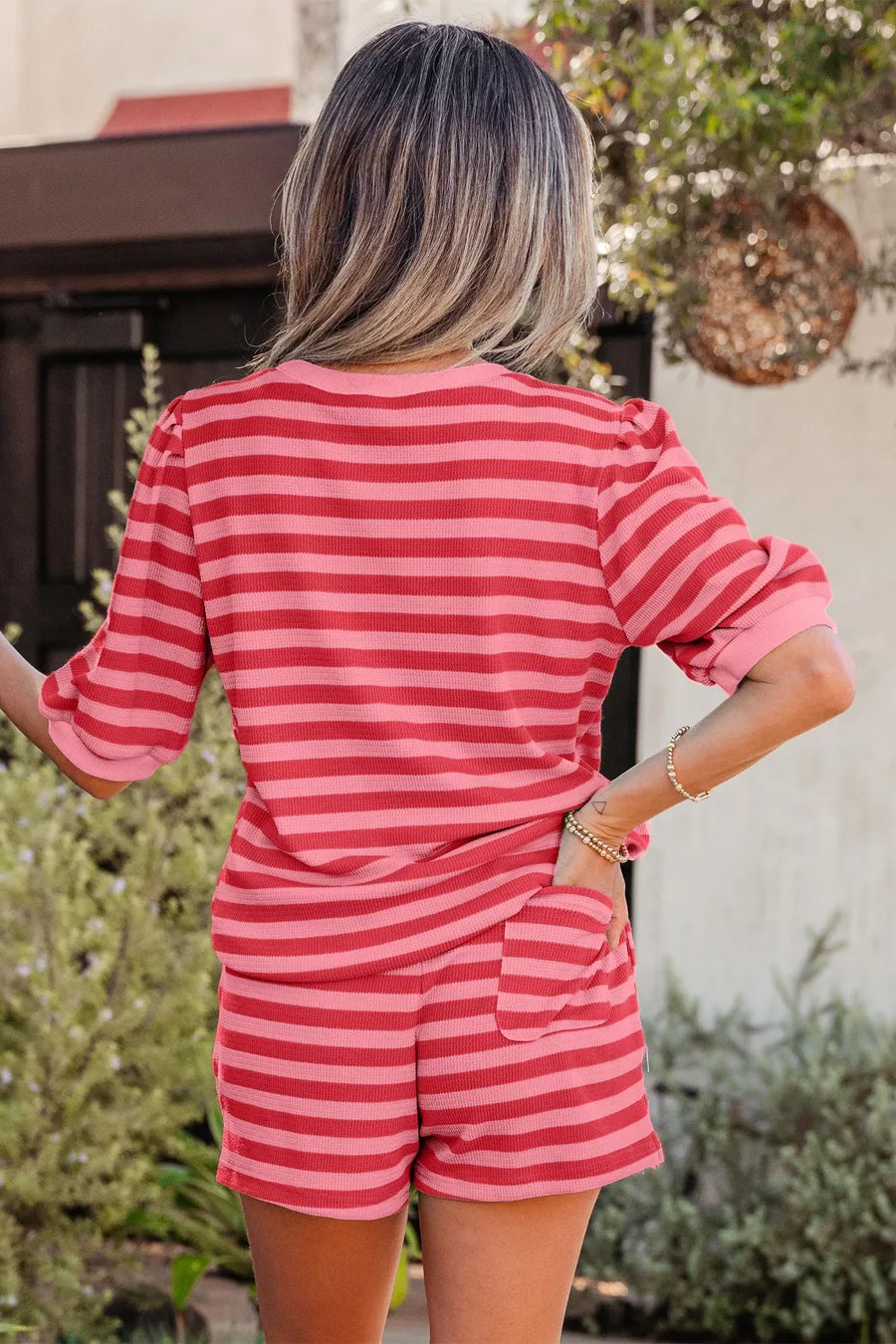 Puffed sleeve striped two-piece set in strawberry pink with drawstring shorts.
