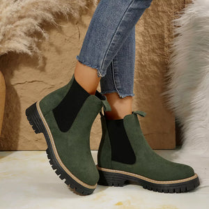 Green suede chelsea ankle boots with chunky sole and elastic side panels.