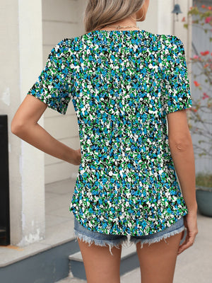 Women's floral print short sleeve blouse with a v-neck.