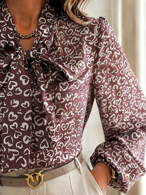 blouse featuring geometric in beige with 100% polyester Care instructions: Machine wash cold texture