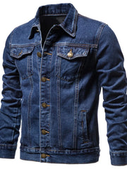 Medium wash denim trucker jacket with button closure and chest pockets.