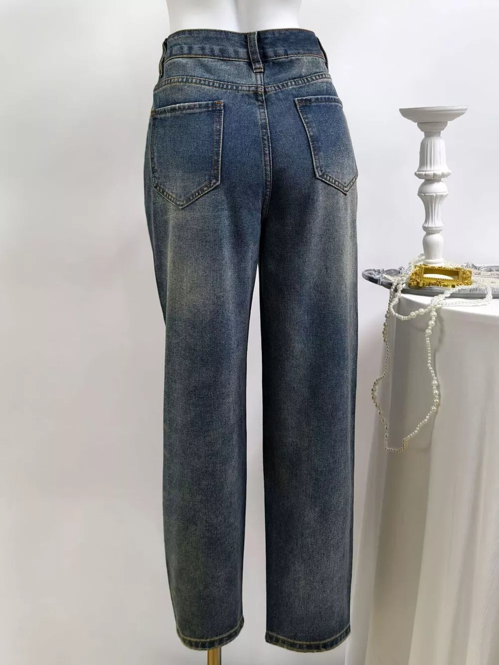 Dark straight jeans with full-length and button-front