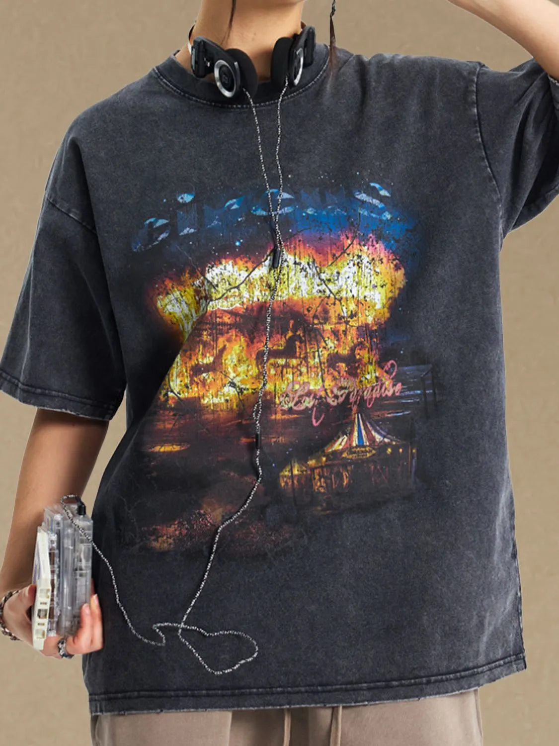 Black vintage circus graphic oversized tee with distressed wash and crew neck.