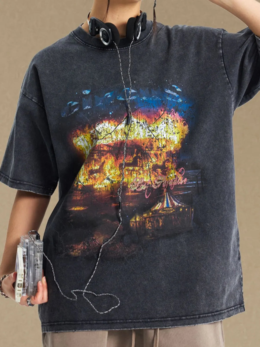 Black vintage circus graphic oversized tee with distressed wash and crew neck.