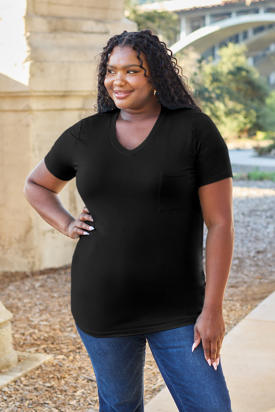 Black V-neck pocket tee with short sleeves and a relaxed fit.