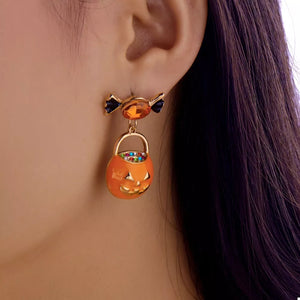 gold earrings featuring rhinestone embellishment and pumpkin motif