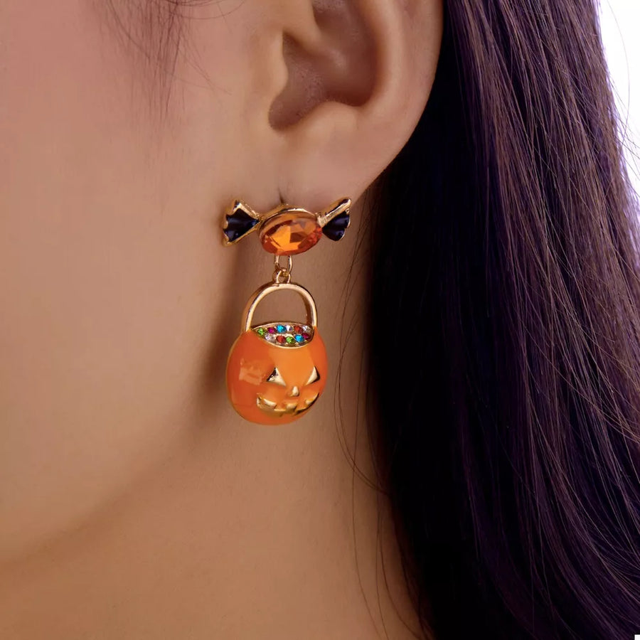 gold earrings featuring rhinestone embellishment and pumpkin motif