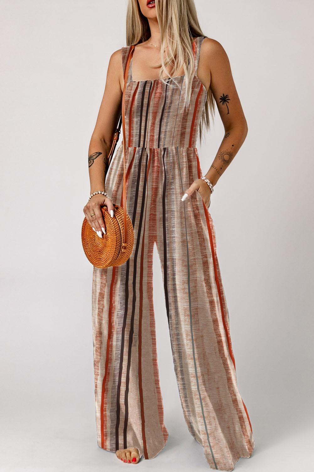 Striped square neck wide-leg romper with pockets and a relaxed fit.