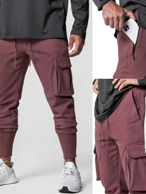 Tech-Knit cargo joggers in dusty pink with zip pocket and drawstring waist.
