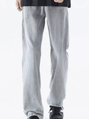 Men's relaxed fit light grey denim jeans with a vintage wash.