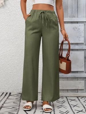 Army green high-waist wide-leg pants with drawstring and pockets.