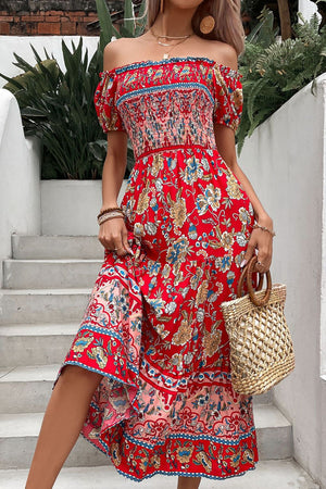 Red floral off-shoulder dress with smocked bodice and tiered skirt.