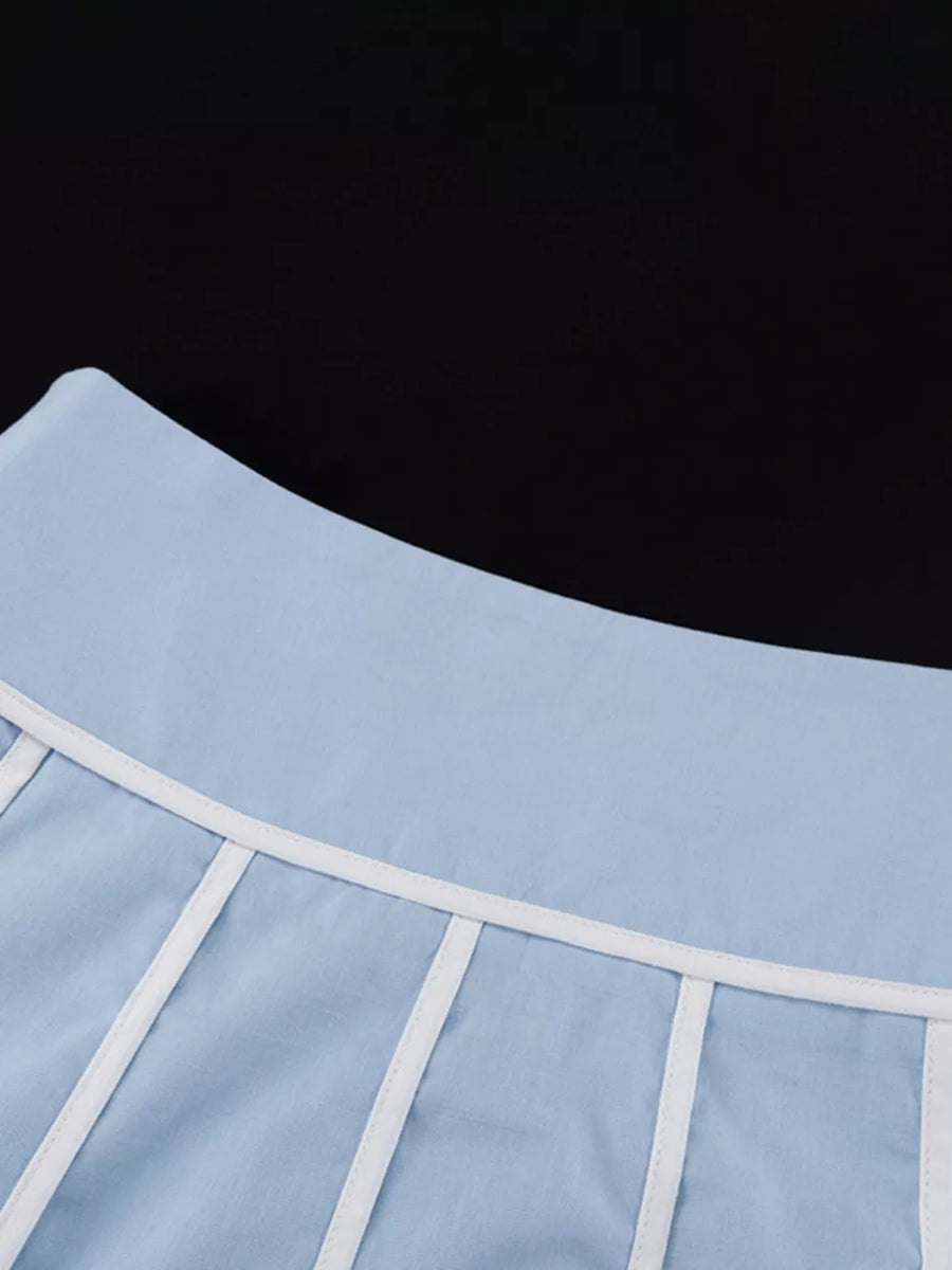 Light blue cotton corset top with white piping detail and boning.