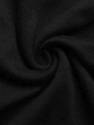 Black ruched long-sleeve dress with a slit detail.