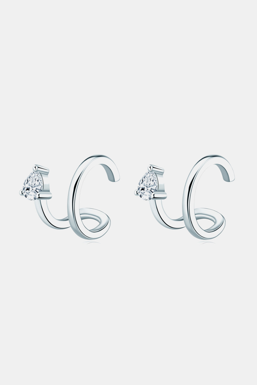 Silver spiral ear cuffs with pear-shaped diamond accents