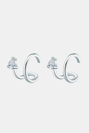 Silver spiral ear cuffs with pear-shaped diamond accents