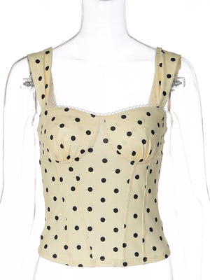 Pastel yellow polka dot sweetheart neckline tank top with lace trim.