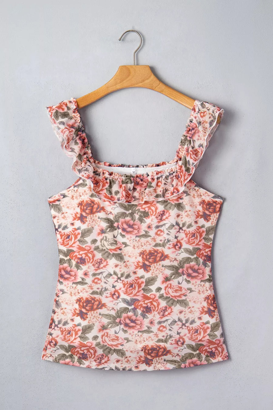 Floral ruffle-trimmed tank top in polyester with a smocked neckline and ruffled straps.