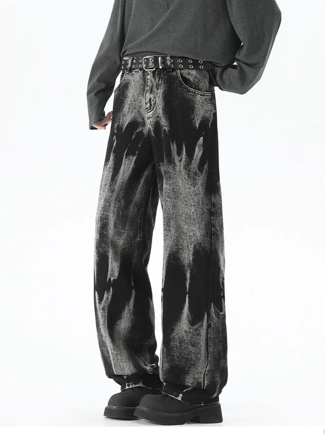 Men's black relaxed fit jeans with acid wash and belted waist.