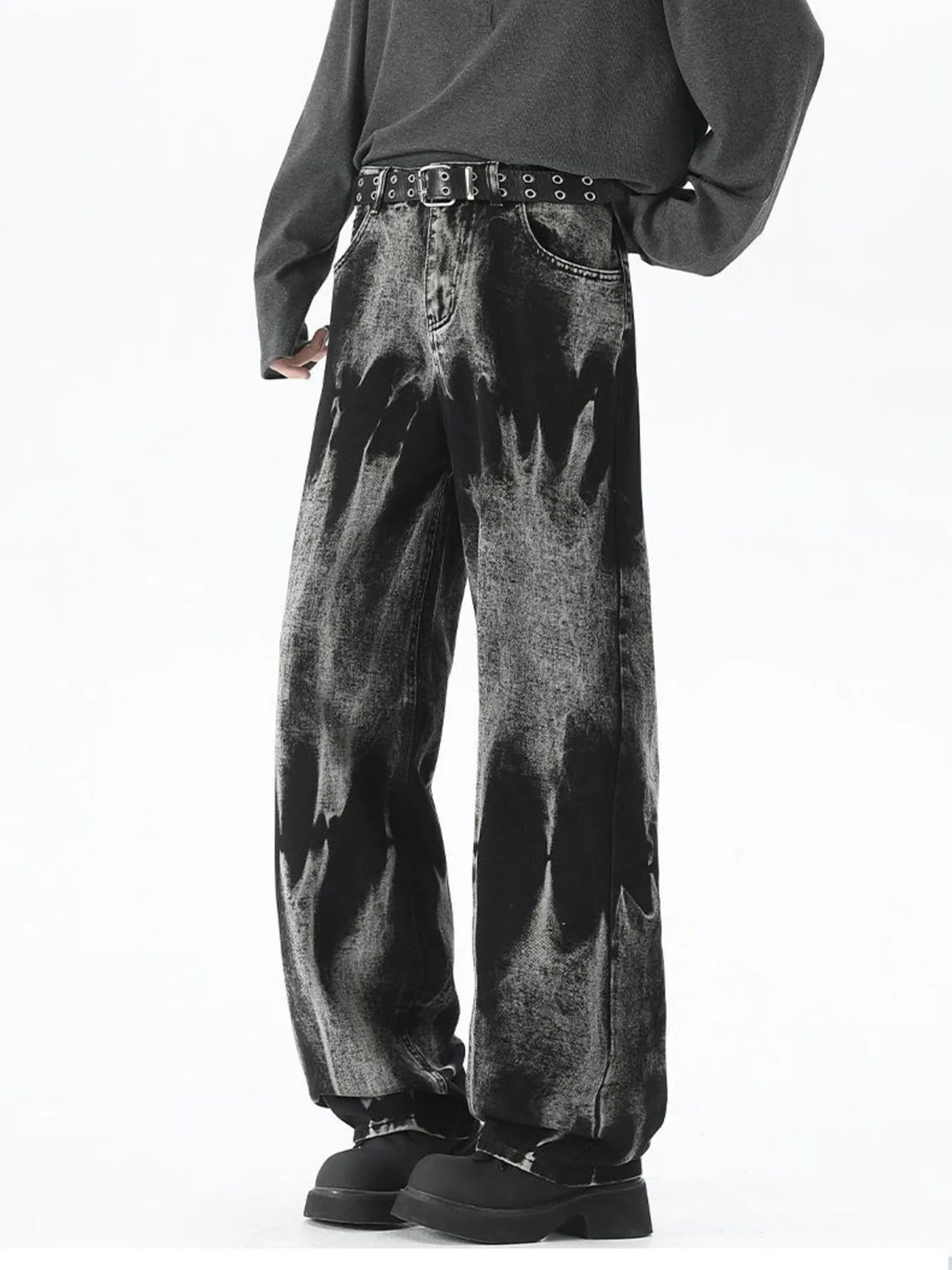 Men's black relaxed fit jeans with acid wash and belted waist.