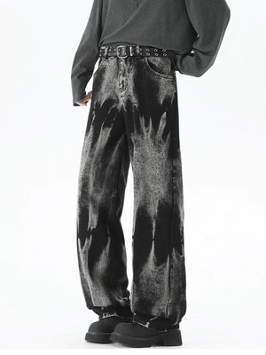 Men's black relaxed fit jeans with acid wash and belted waist.