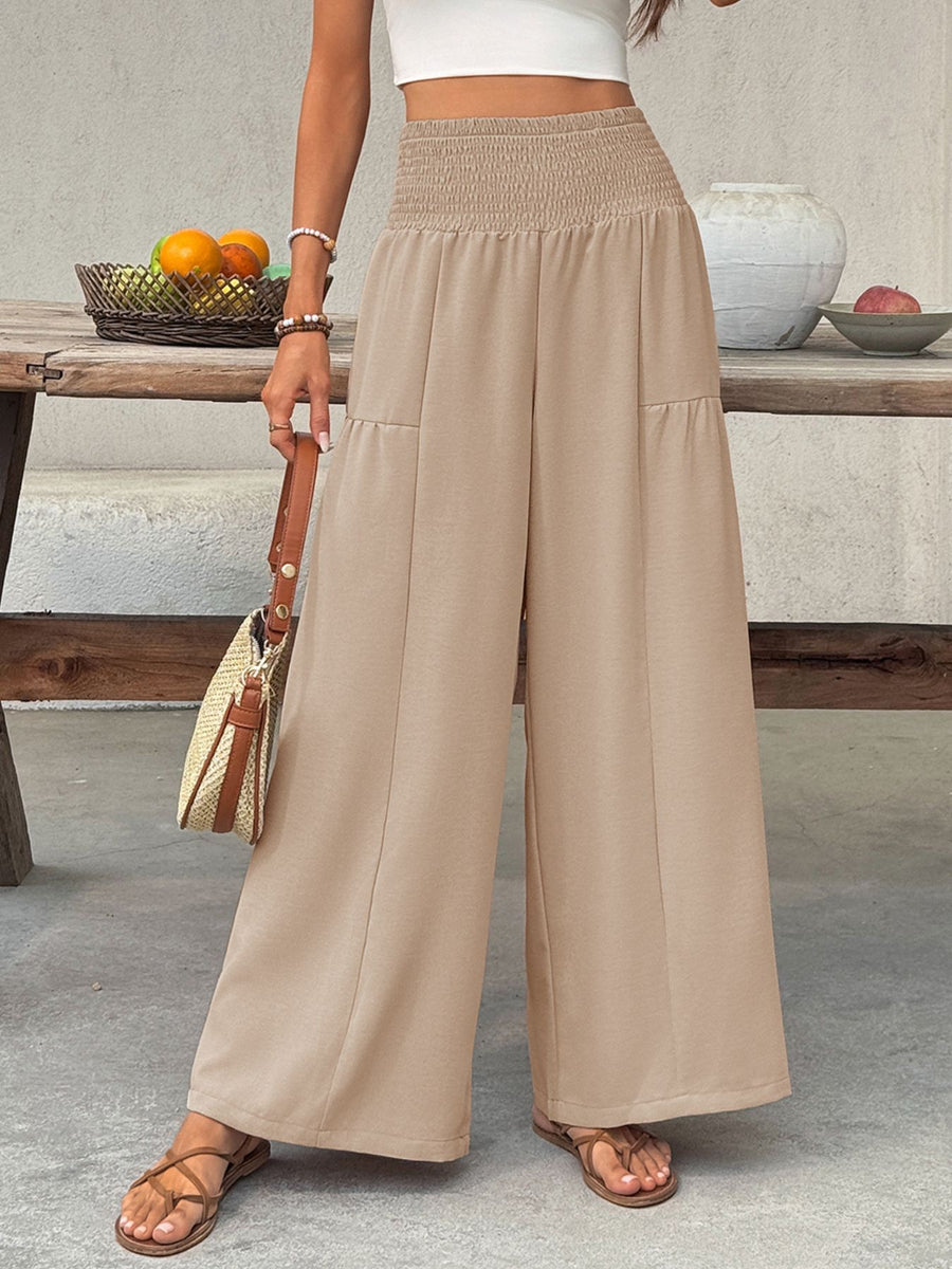 Smocked waist wide leg cotton trousers in beige with a relaxed fit.