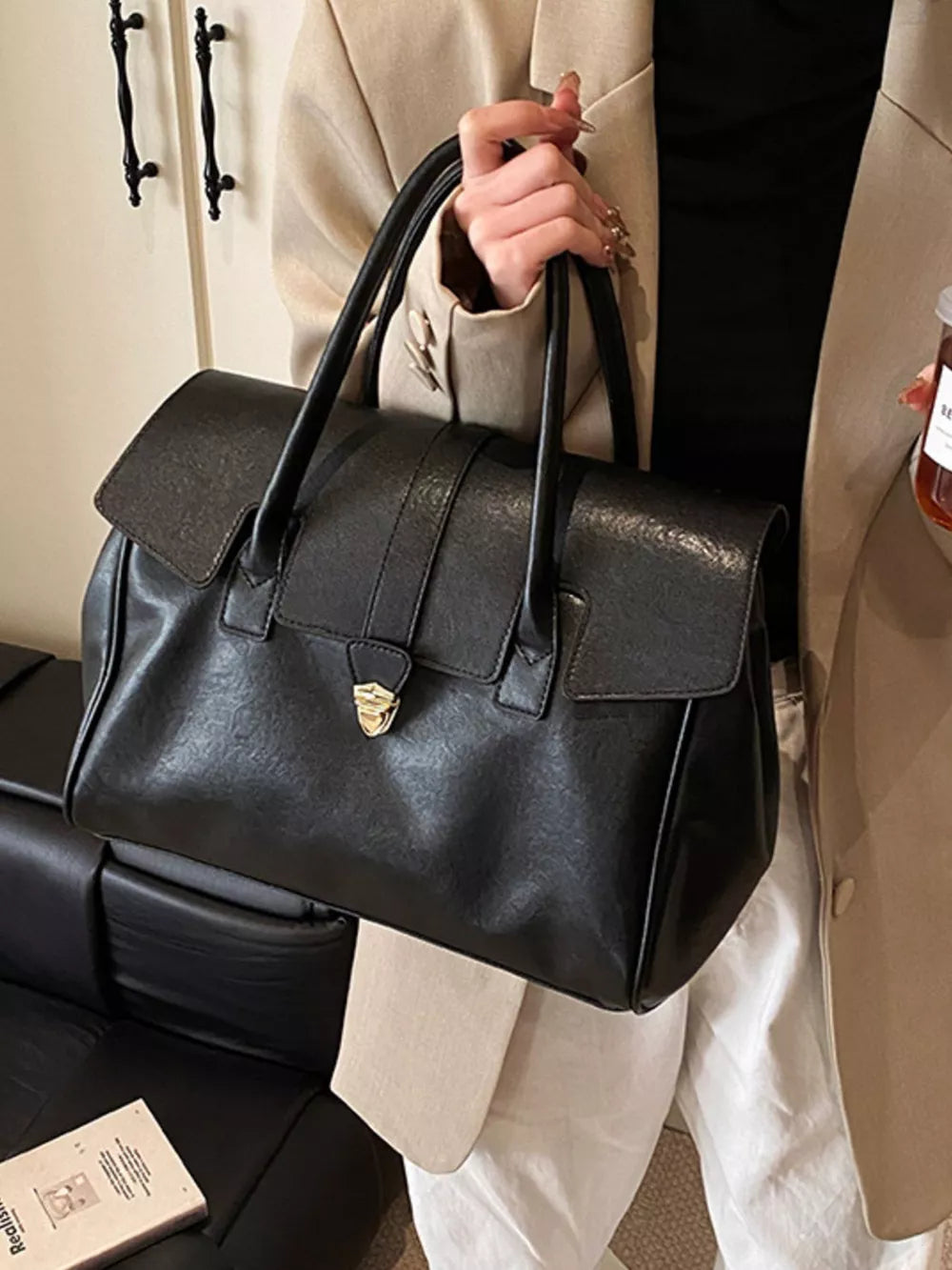 Black pu leather tote bag with buckle detail and top handles