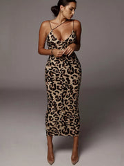 Leopard print midi dress with spaghetti straps and deep v-neck