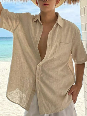 Relaxed fit beige linen button-down shirt with short sleeves and a chest pocket.