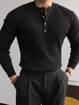 Black ribbed knit henley sweater with button accents and long sleeves.