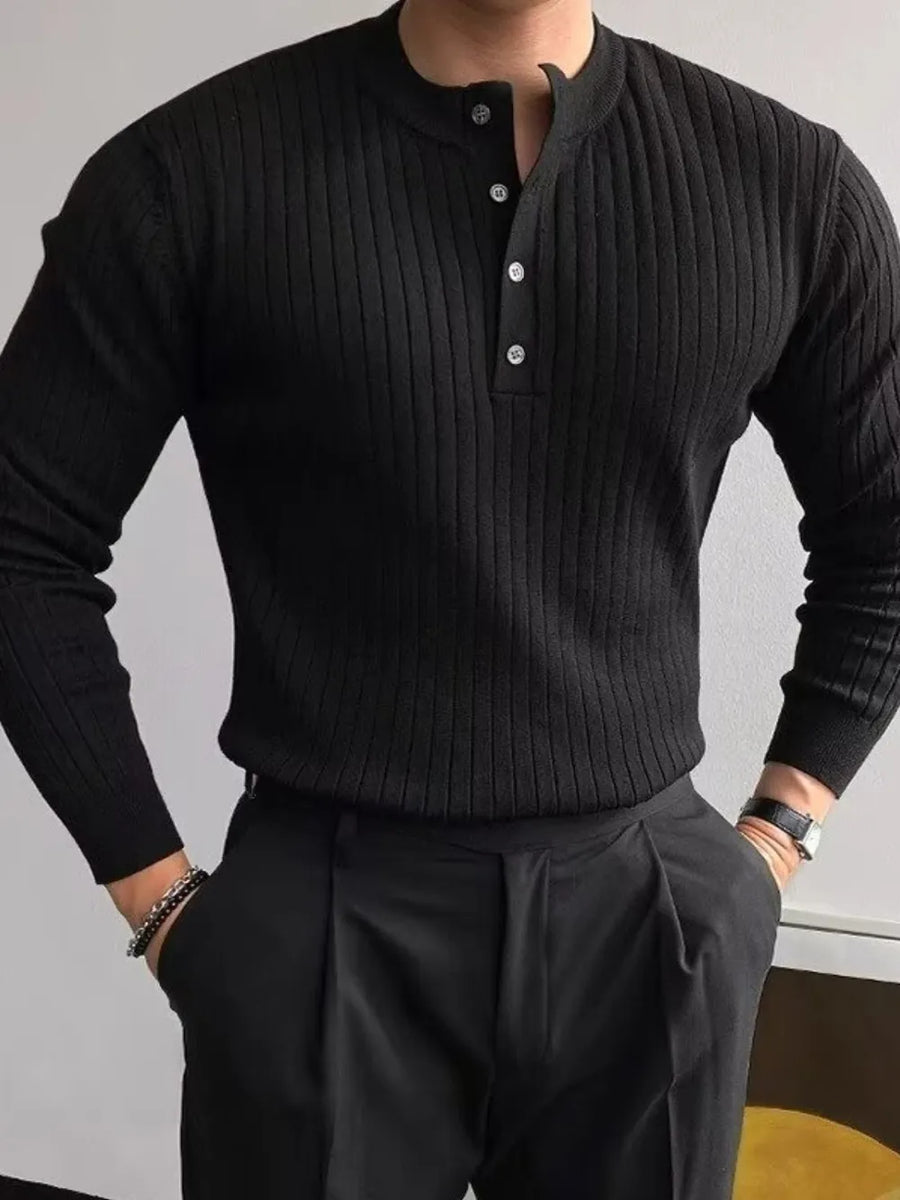 Black ribbed knit henley sweater with button accents and long sleeves.