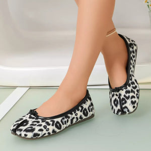 white flats featuring split-toe and leopard-print