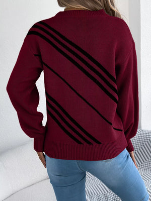 Maroon acrylic blend sweater with black diagonal stripes, round neck, and long sleeves.