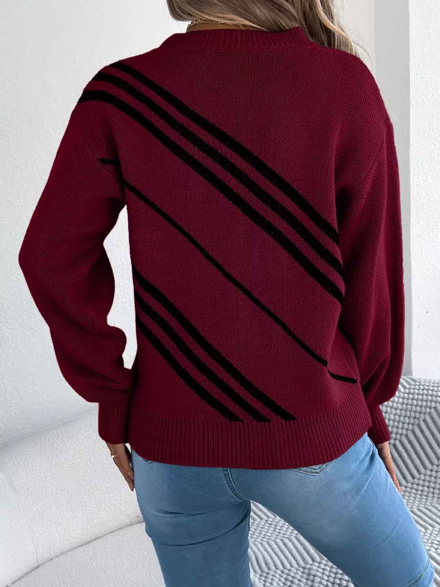 Maroon acrylic blend sweater with black diagonal stripes, round neck, and long sleeves.