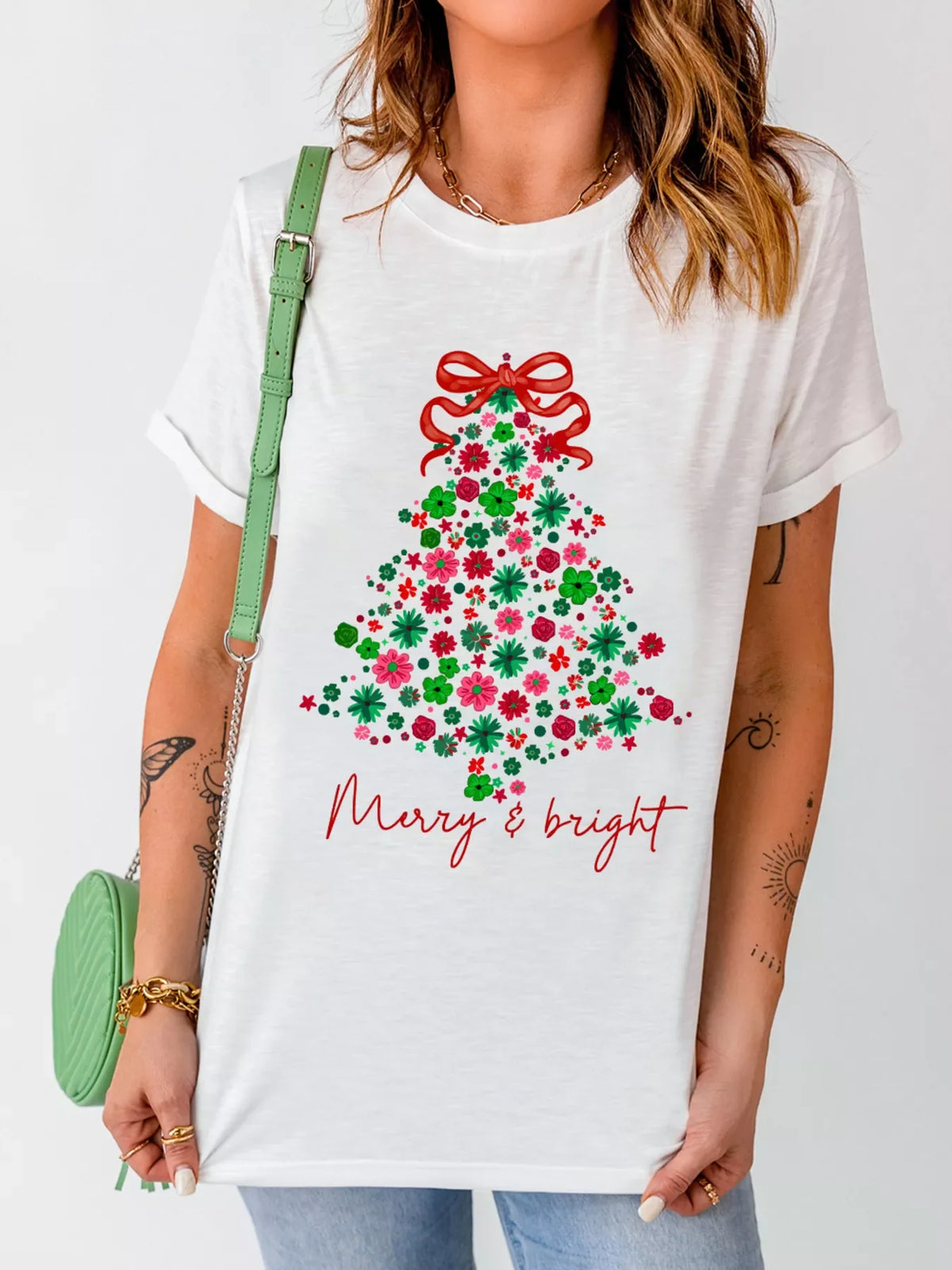White t-shirt with floral Christmas tree graphic and Merry & bright text.