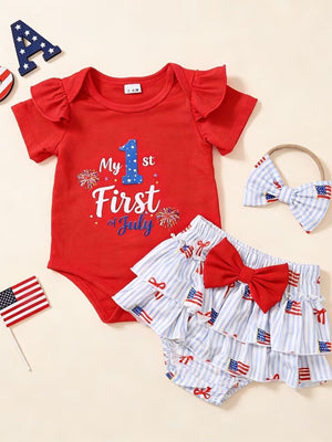 Red baby onesie with "My 1st of July" graphic, striped bloomers with flag print, and matching headband.
