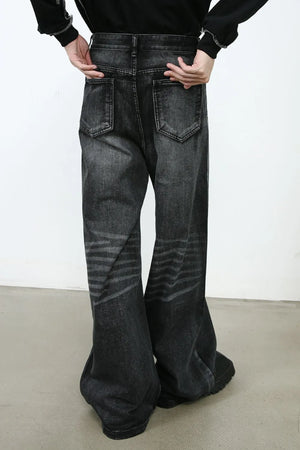 Sculpted flare denim trousers in dark wash with horizontal stripe detailing on the legs.