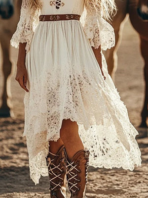White lace trim high-low dress with bell sleeves and cutout detail.