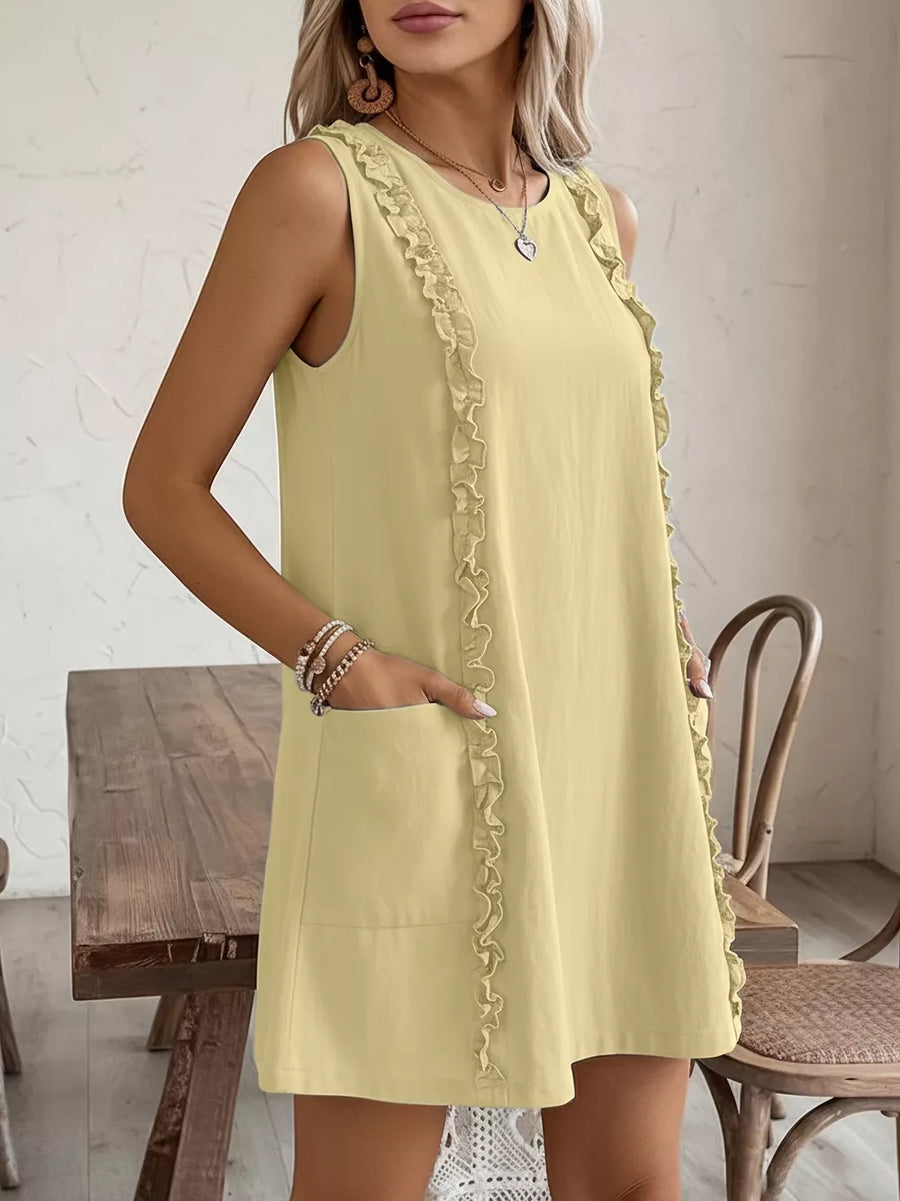 Pastel yellow sleeveless dress with frill detail and pockets.